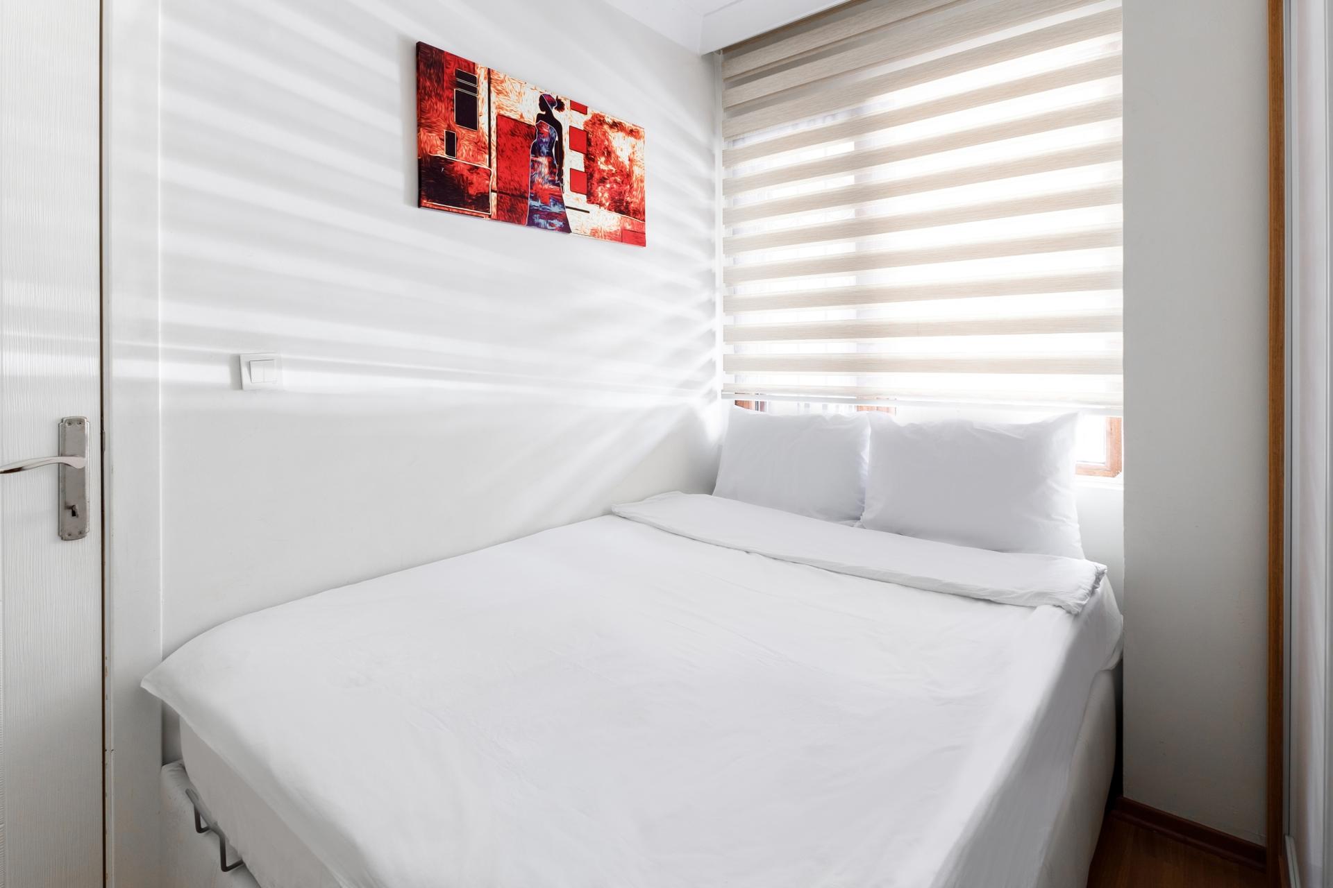 Relax and unwind in our cozy bedroom with a comfortable double bed.