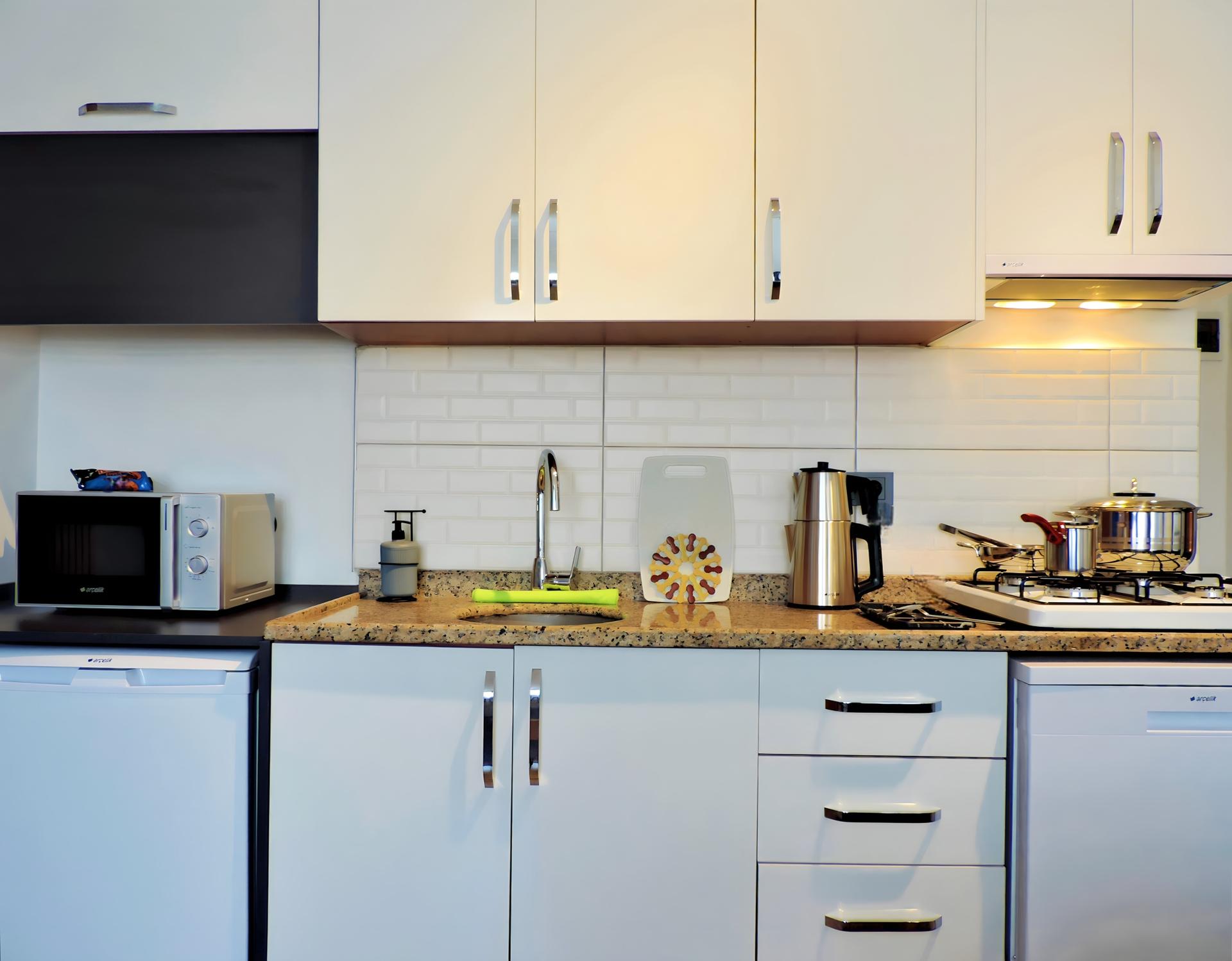 Step into our kitchen, where modern design meets practical functionality.