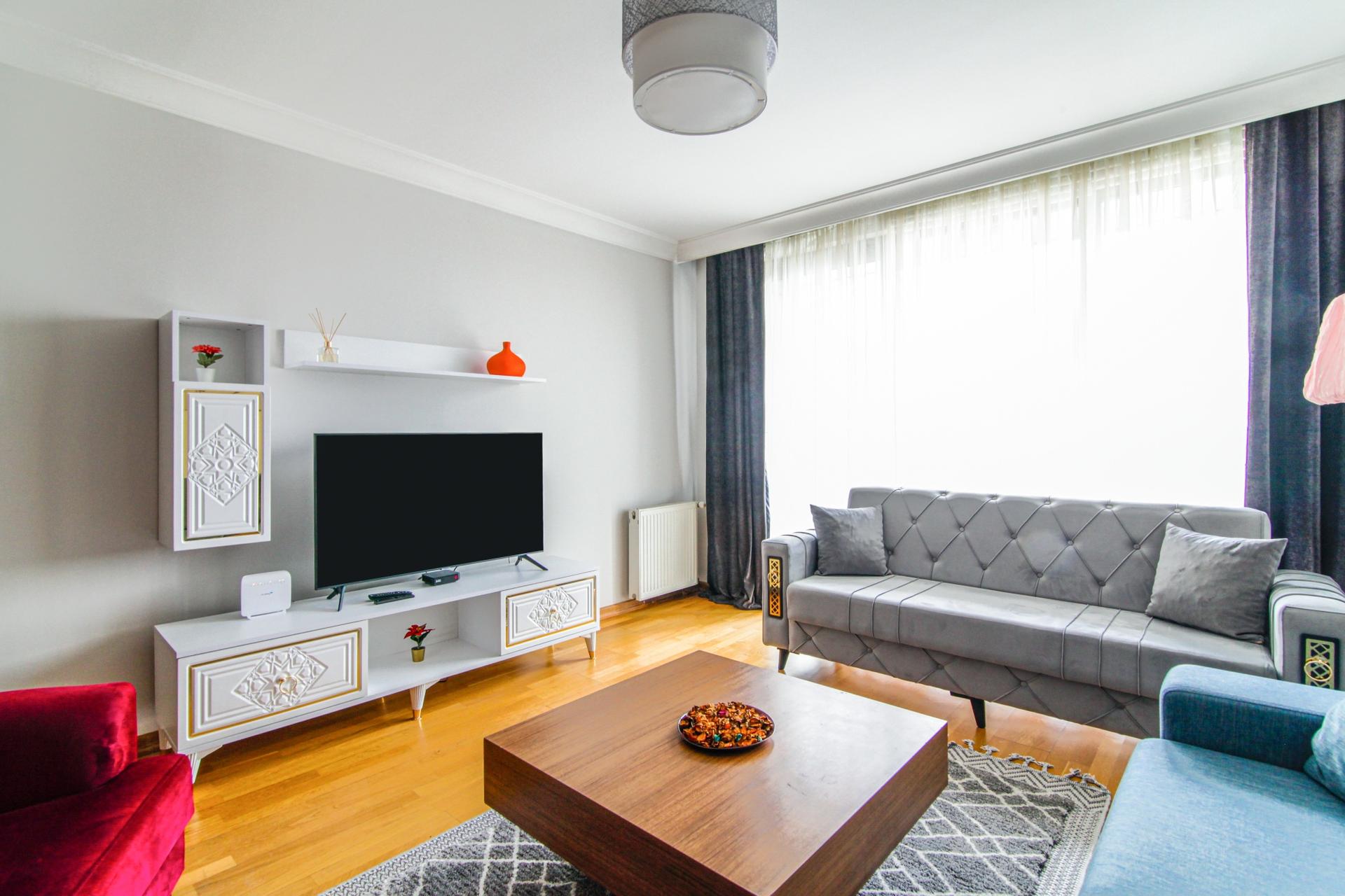 A spacious and luminous living room awaits you here.