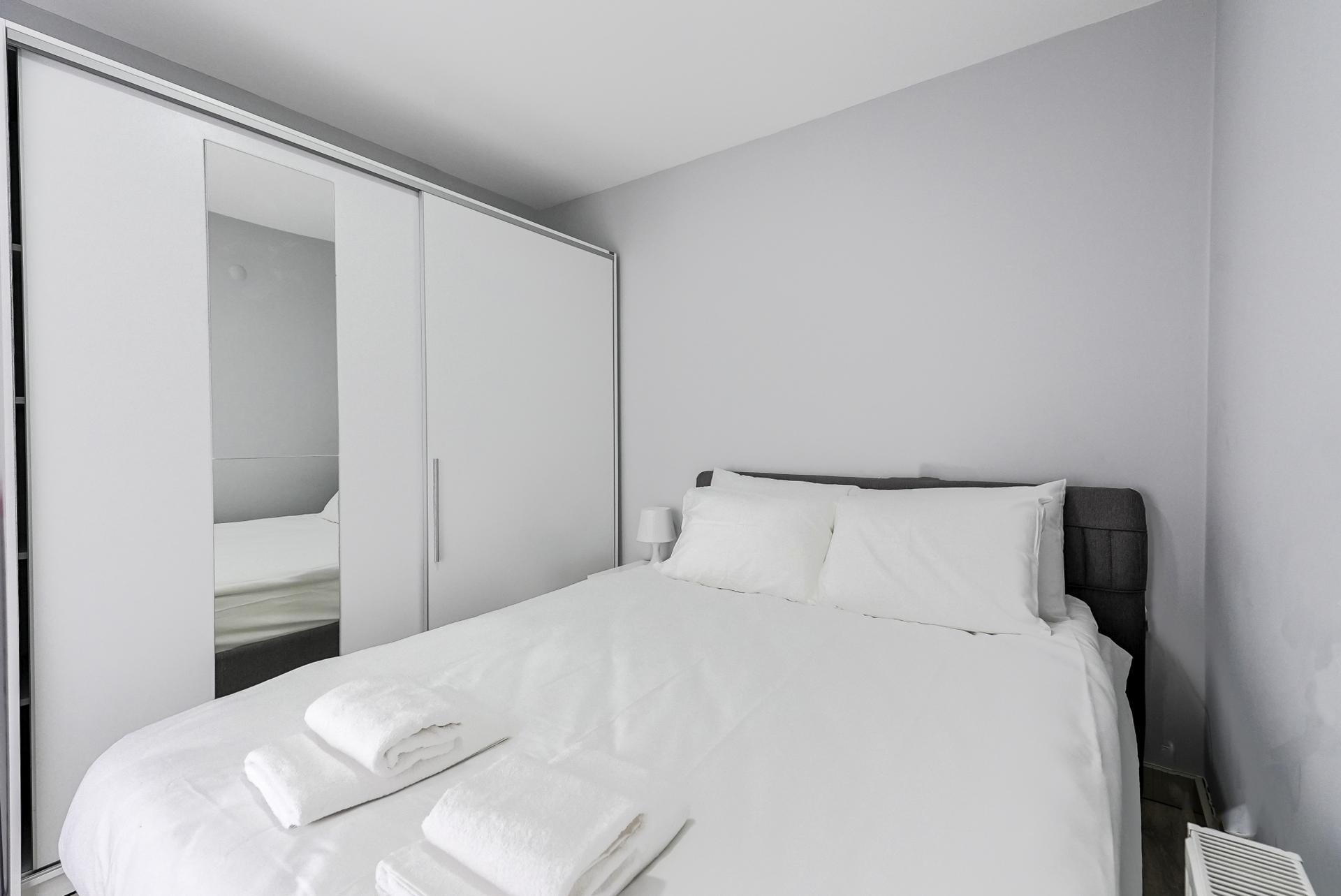 You are invited to have a peaceful sleep surrounded with divine white in the bedroom.