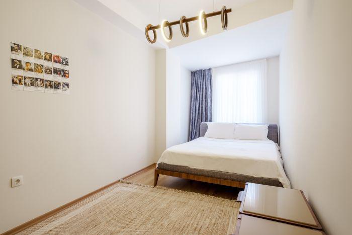 It’s a sun-soaked bedroom with a double bed and a spacious wardrobe!