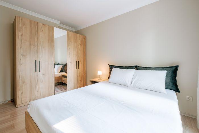 A comfortable double bed and a large wardrobe, everything necessary for a vacation.