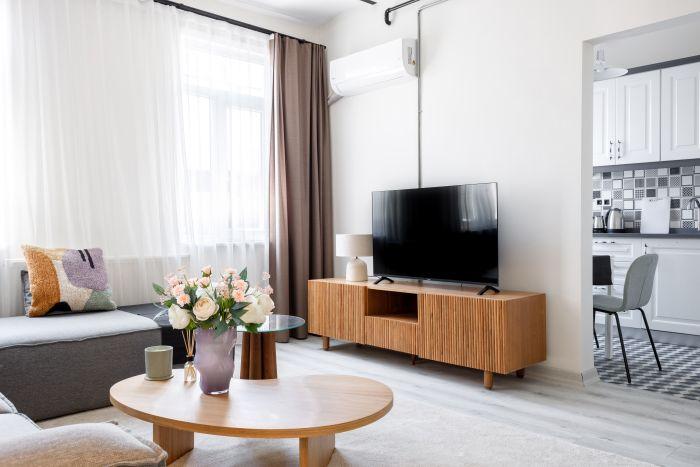 Our living room boasts a blend of modern aesthetics and functionality, a place where everyone feels welcome.