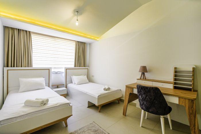 Rest and recharge in our cozy bedroom furnished with comfortable single beds.