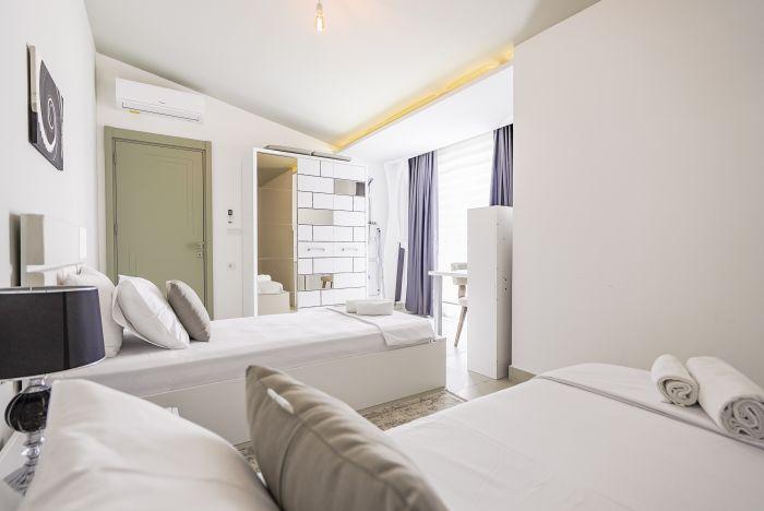 Rest easy in our well-equipped bedroom with twin beds, offering a comfortable and enjoyable stay.