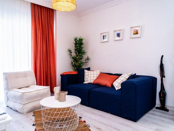 The cozy and warm ambiance of the living room, perfect to feel at home.