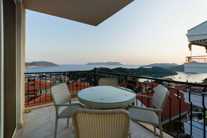 Escape to our house's balcony, where you can enjoy private moments with the sea as your backdrop.