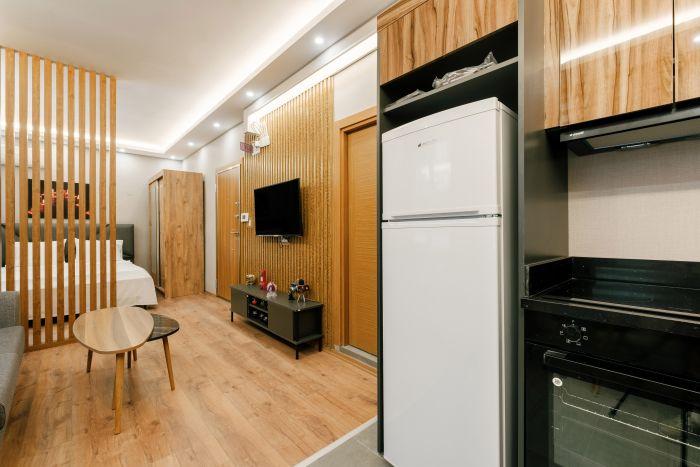The room also features a kitchenette where you can cook meals.