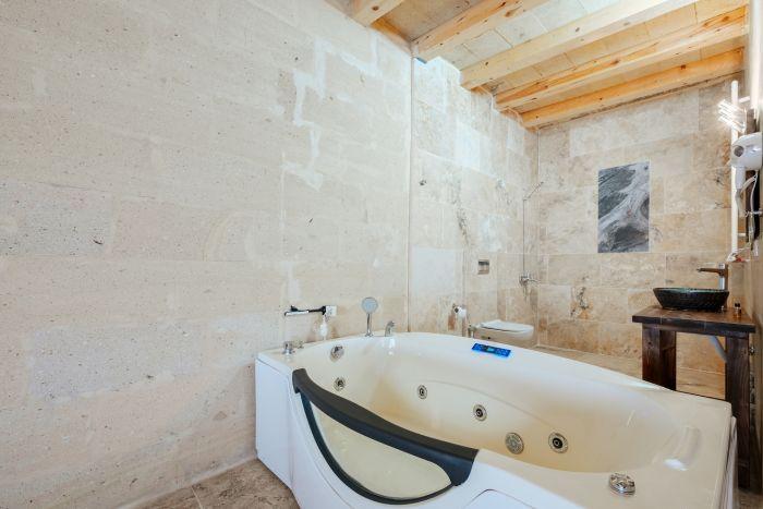 Elegant Bathroom with a Relaxing Jacuzzi Tub for Ultimate Indulgence.