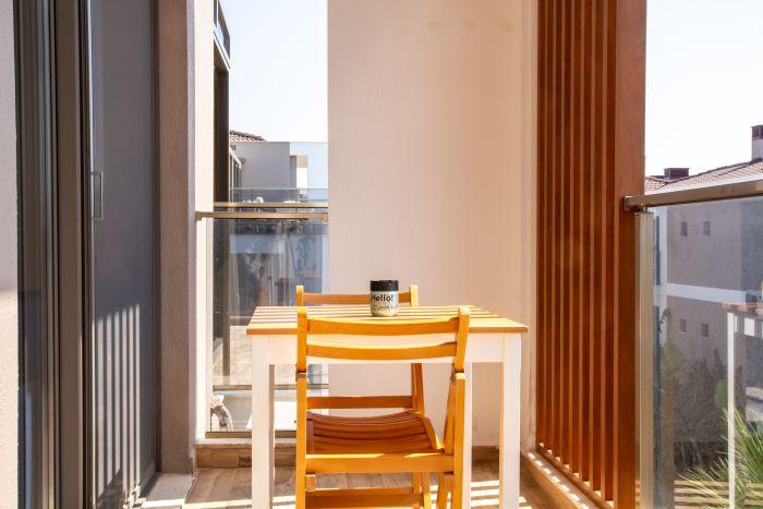 Sip your morning coffee or enjoy an evening drink on your balcony's cozy coffee table.