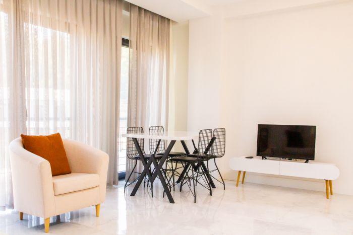 Our living room, a perfect blend of elegance and comfort, serves as a gathering space for all family members.