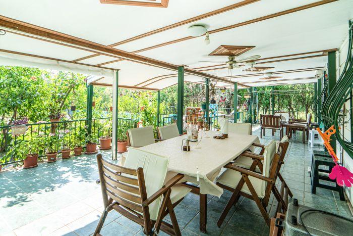 Savor unforgettable meals in the embrace of nature at this charming garden dining table.