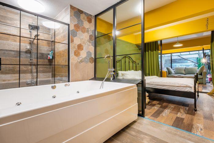 Indulge in a spa-like experience with a private hot tub in our beautifully designed bathroom.
