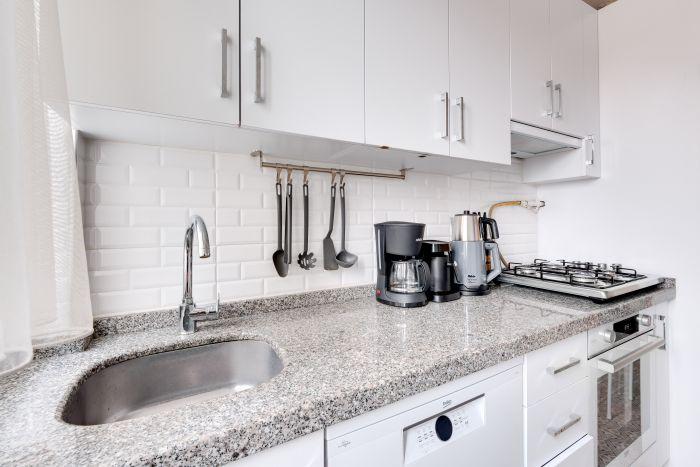 Our kitchen is a chef's dream, complete with modern amenities and ample space.
