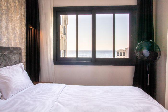 Feel rejuvenated in our bedroom, waking up to the breathtaking sight of the sea just outside your window.