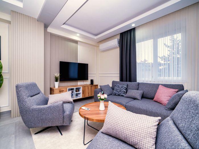 Immerse yourself in the warm and welcoming ambiance of our well-appointed living room.