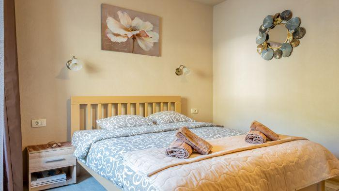 Our main bedroom featuring a double bed  is designed for your comfort.