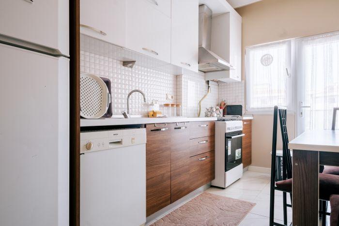 Our kitchen, with its warm tones and inviting layout, is the heart of the home.