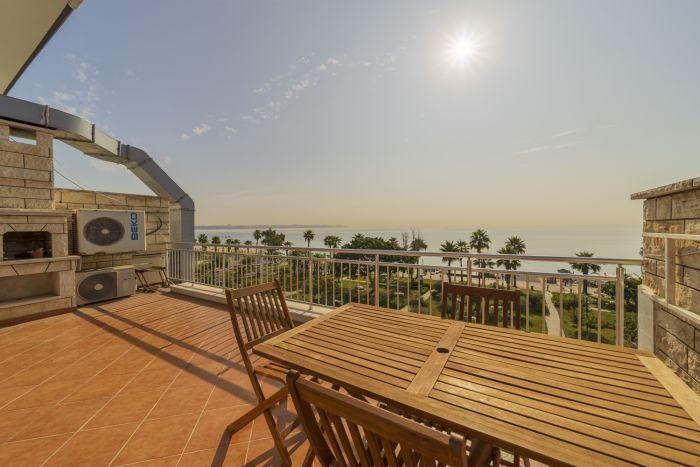 Enjoy a private and intimate setting on our house's terrace, offering unobstructed sea views.
