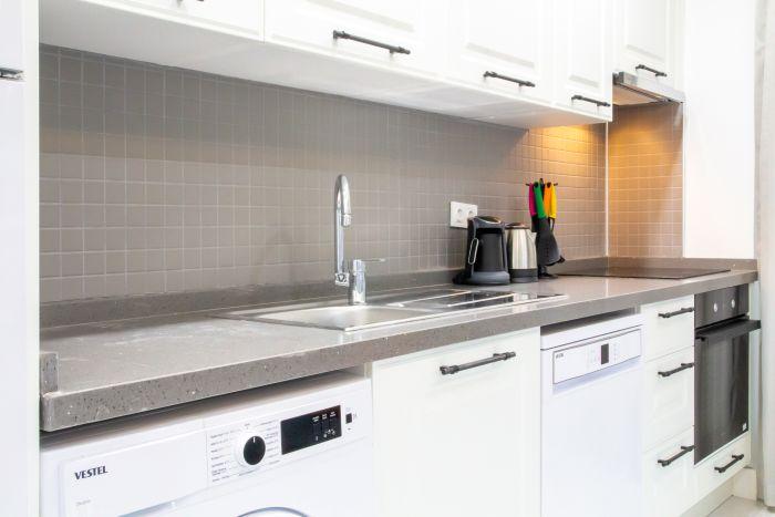 Step into our kitchen, where modern design meets practical functionality.
