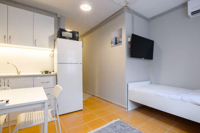 A sleek, modern studio room, beautifully furnished to maximize both comfort and style.