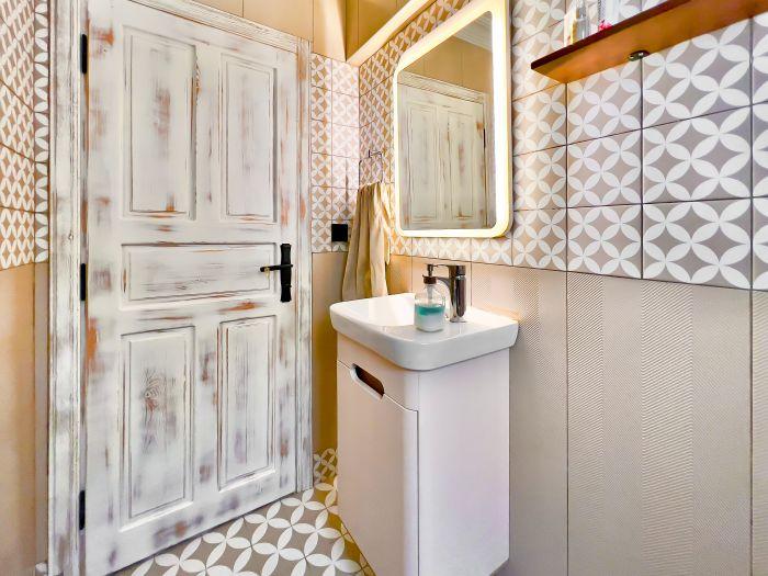 Experience the harmony of form and function in our chic bathroom, your personal haven for unwinding.