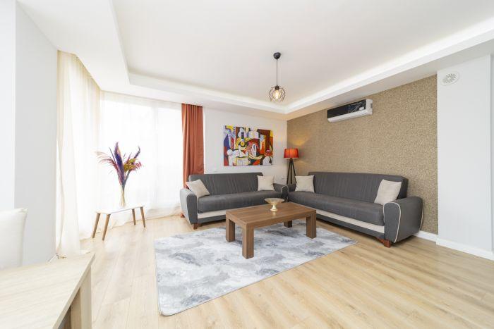 Our spacious living room features all the necessary amenities to make you feel at home. 