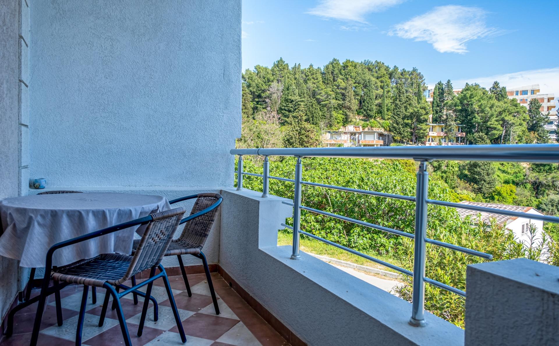 Our nature-view terrace flat has a double bed and a single bed…