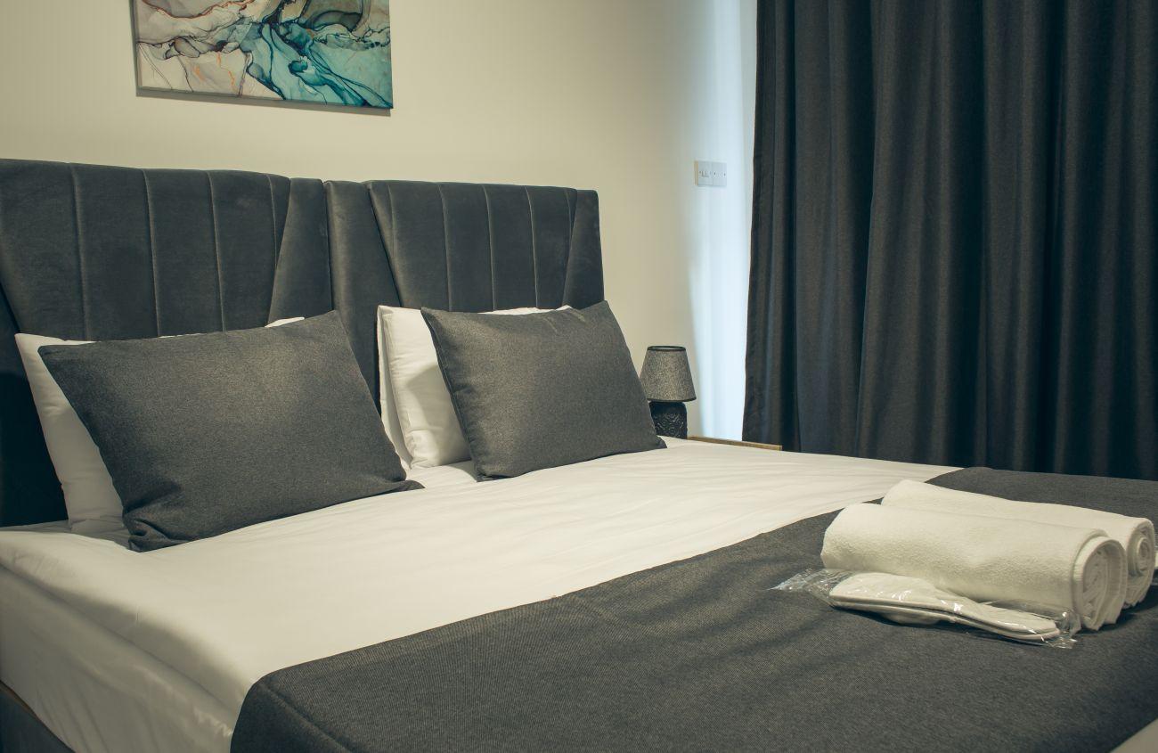 Our cozy bed is ideal for a restful sleep.