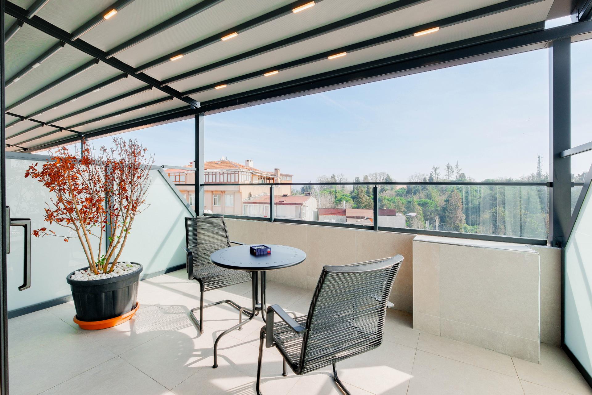 Enjoy the fresh air and panoramic vistas from our house's expansive terrace.