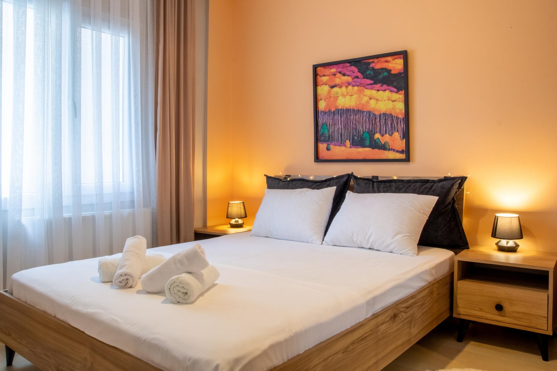 The main bedroom features a cozy double bed and decorative objects to enhance your comfort and relaxation.