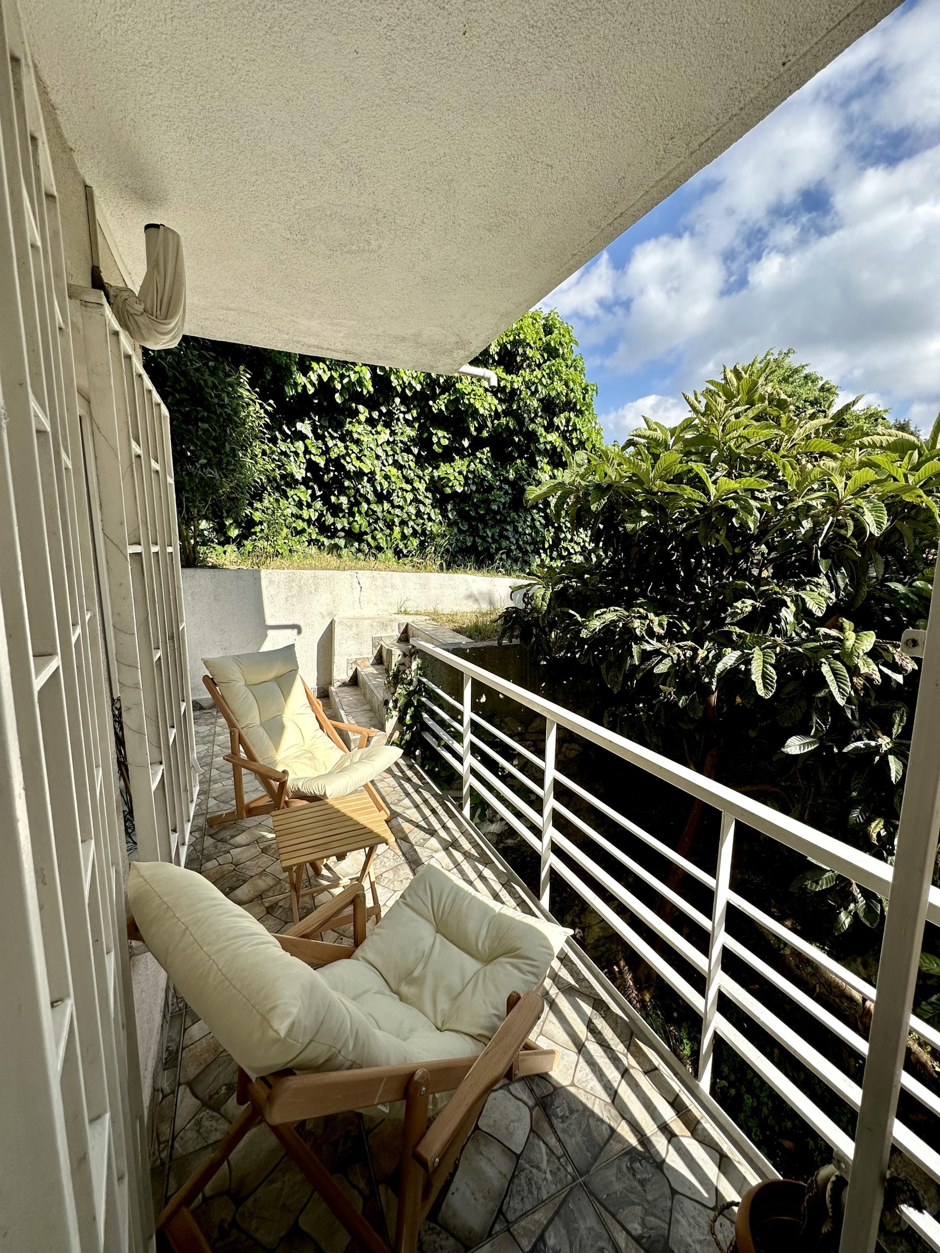 A refreshing balcony for you, hidden by the blue sky and lush trees…