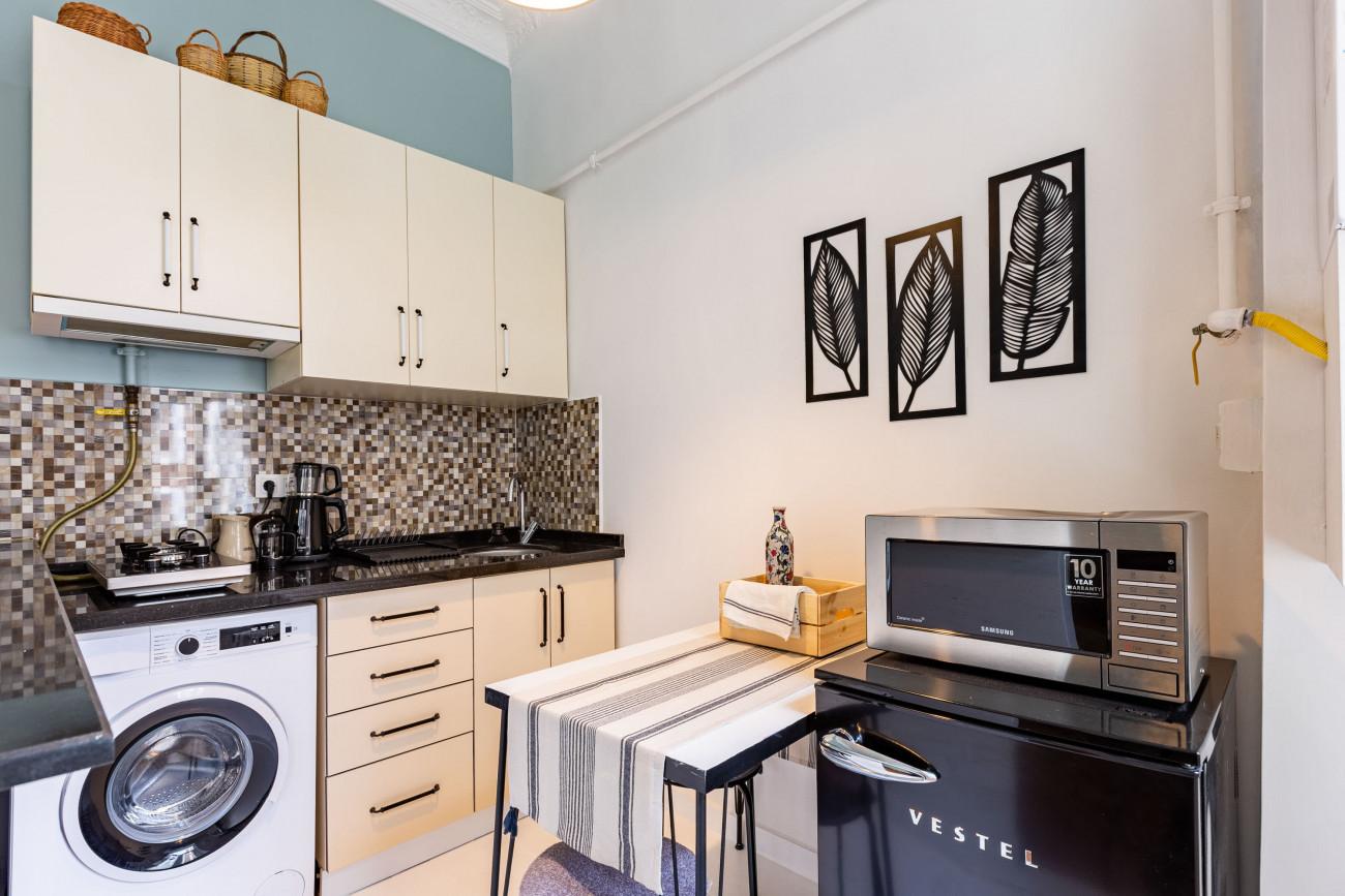 The kitchen is fully equipped with necessary white goods and appliances.