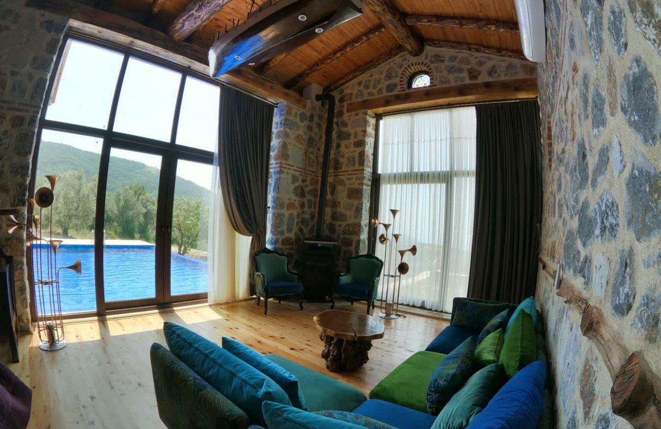 The sofas have a lovely view of the pool and the nature.