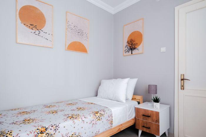 Experience a peaceful night's sleep in our cozy bedroom furnished with a plush single bed.