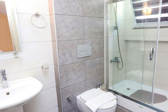 Ensuite bathrooms include showering space and lavatory.