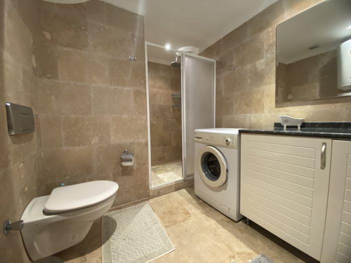 The villa features two bathrooms, and one of them includes a washing machine.