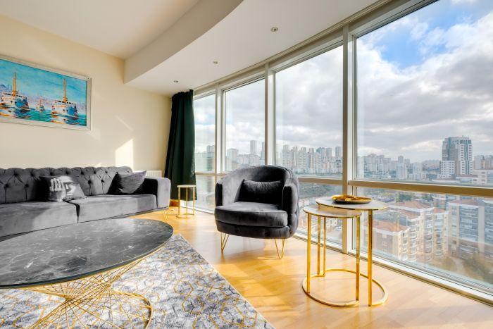 A living room where minimalist design meets stunning city vistas.