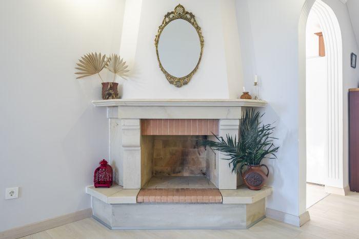 You can cozy up by the stylish fireplace on cold nights.