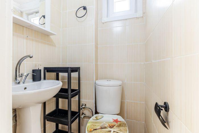 Our apartment features a compact yet functional bathroom.