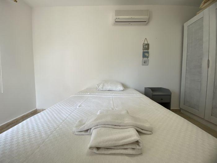 The second bedroom features a double bed and a large wardrobe for your belongings.