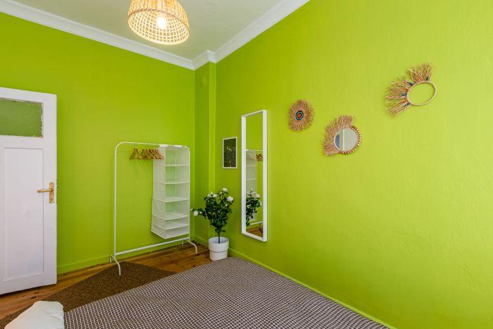 Wouldn't you like to wake up with a pop of energy? The lime-colored walls come to the rescue.