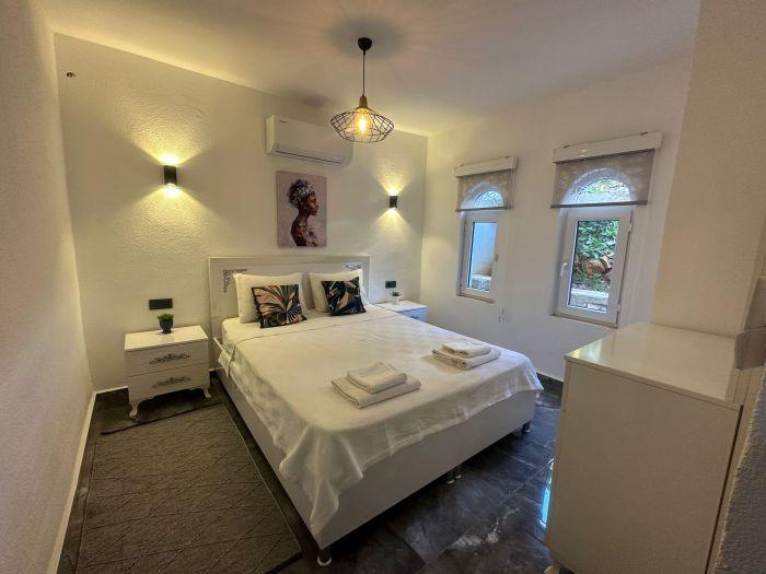 Minimalist-designed bedroom combined with elegant style.
