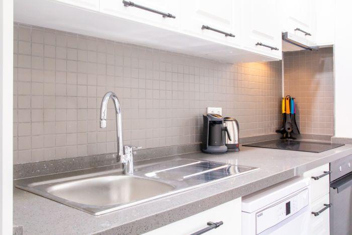 Our kitchen's sleek design and high-tech appliances make meal prep a breeze.