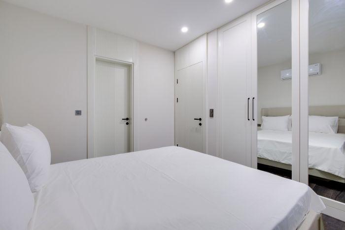 A comfortable double bed and a large wardrobe, everything necessary for a vacation.