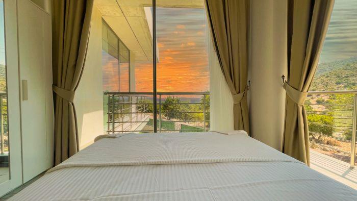 No, it’s not from Bob Ross, it's real! You will wake up to this view in Villa Finike...