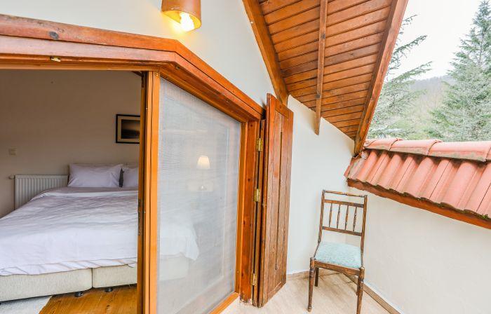 You can access a small balcony from this bedroom.