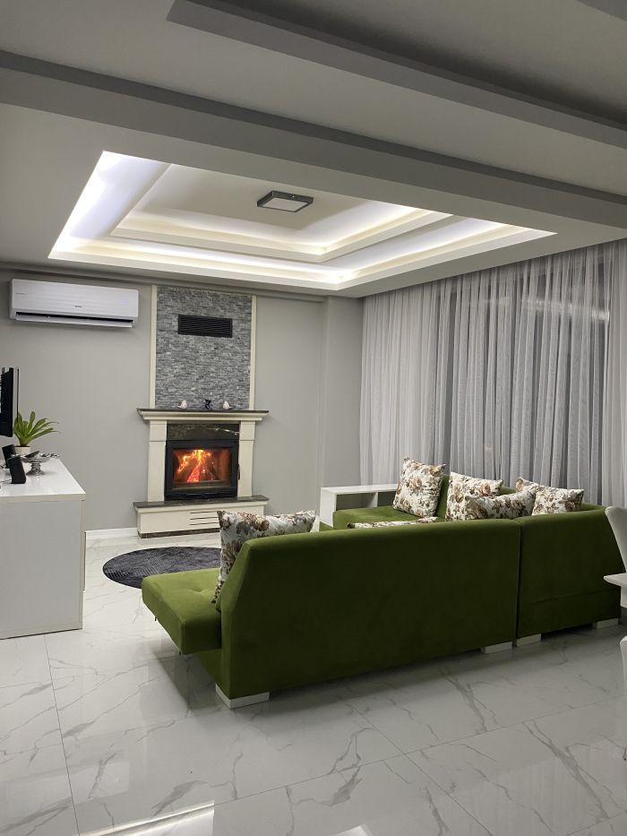 As the chilly winter days approach, our second living room awaits you with a charming fireplace.