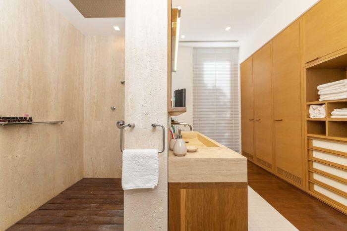 There are closets located in the bathrooms for more storage space.