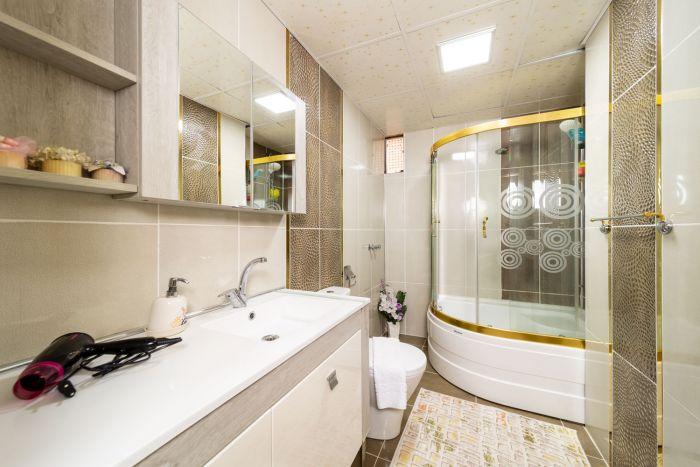 The main bathroom is modern and neat with a touch of dazzle.